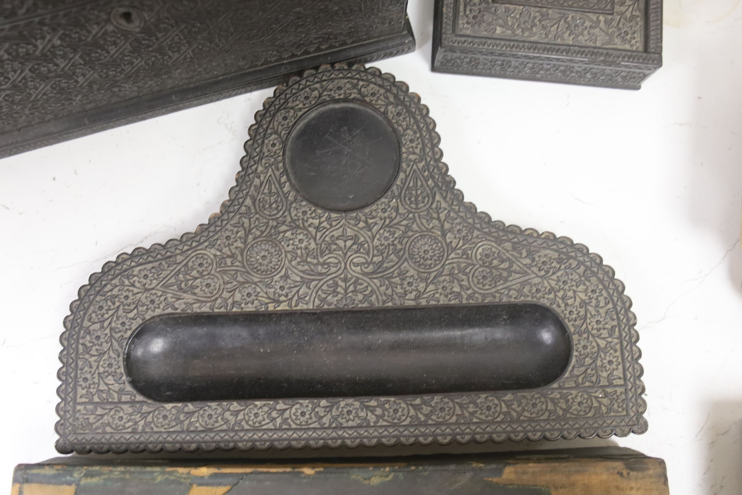 A James Cockings leather box containing a vellum patent letter with Queen Victoria Grand seal with an Indian carved box, pen stand etc